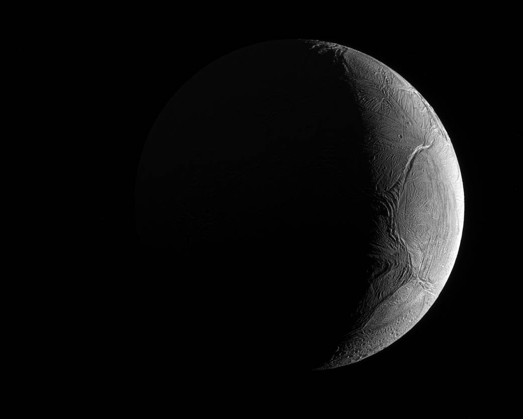 Saturn's Icy Moon Enceladus, a Possible Home for Life, Shines in Photo